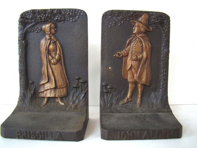 A pair of Pilgrim father John Alden and his wife Priscilla antique cast iron bookends circa 1920